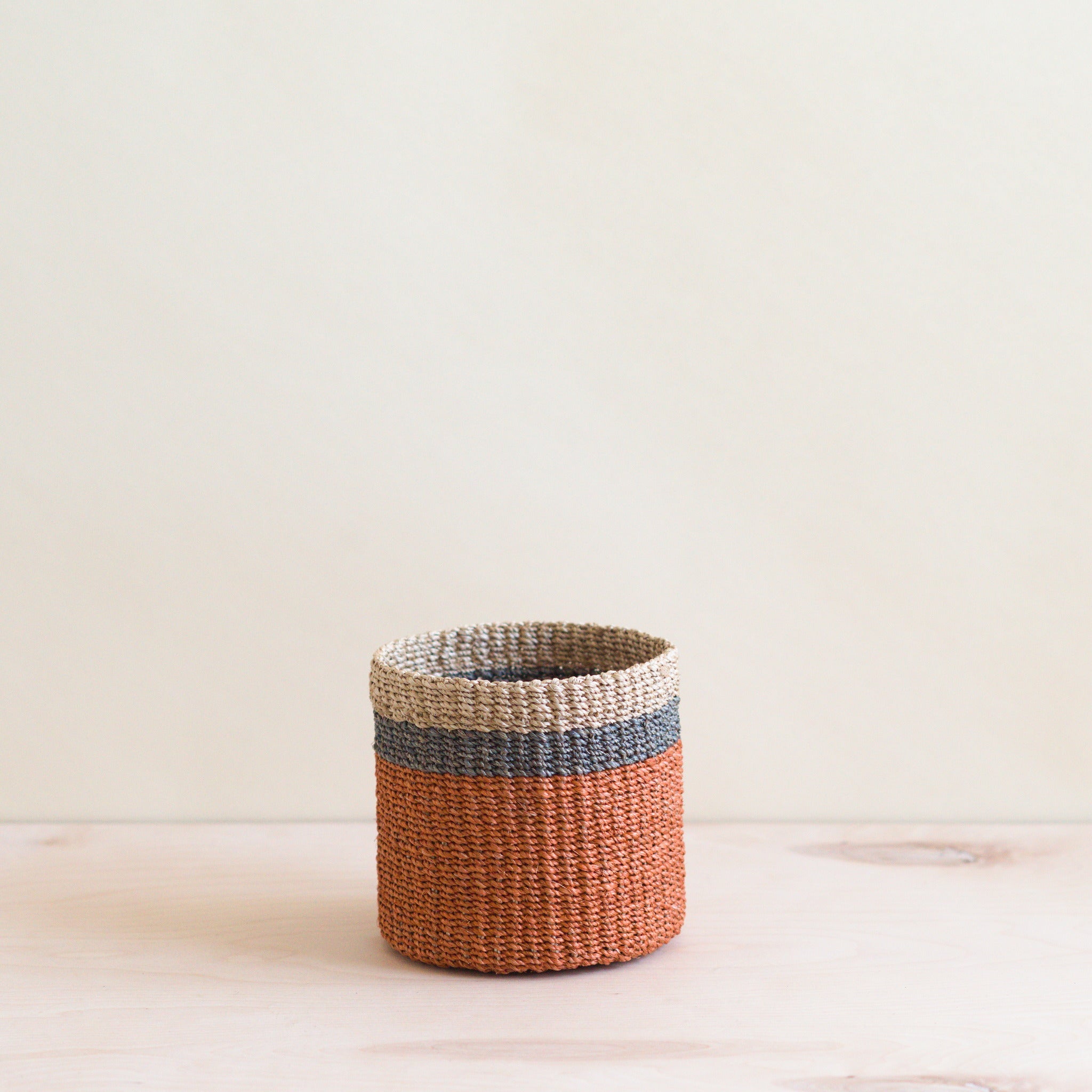 LIKHA_80004_Abaca-Cylinder-Tabletop-Basket_Coral-1.jpg