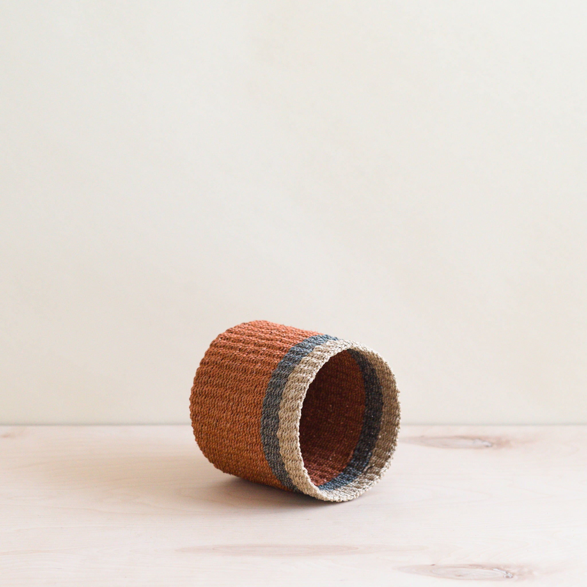 LIKHA_80004_Abaca-Cylinder-Tabletop-Basket_Coral-4.jpg