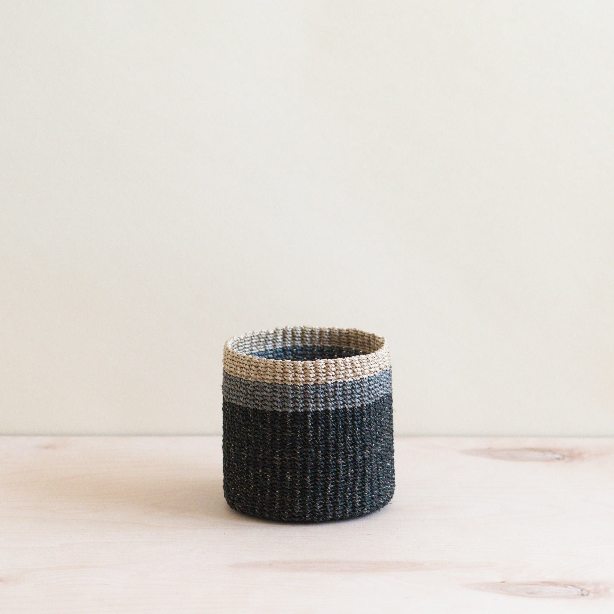 LIKHA_80005_Abaca-Cylinder-Tabletop-Basket_Black-1.jpg