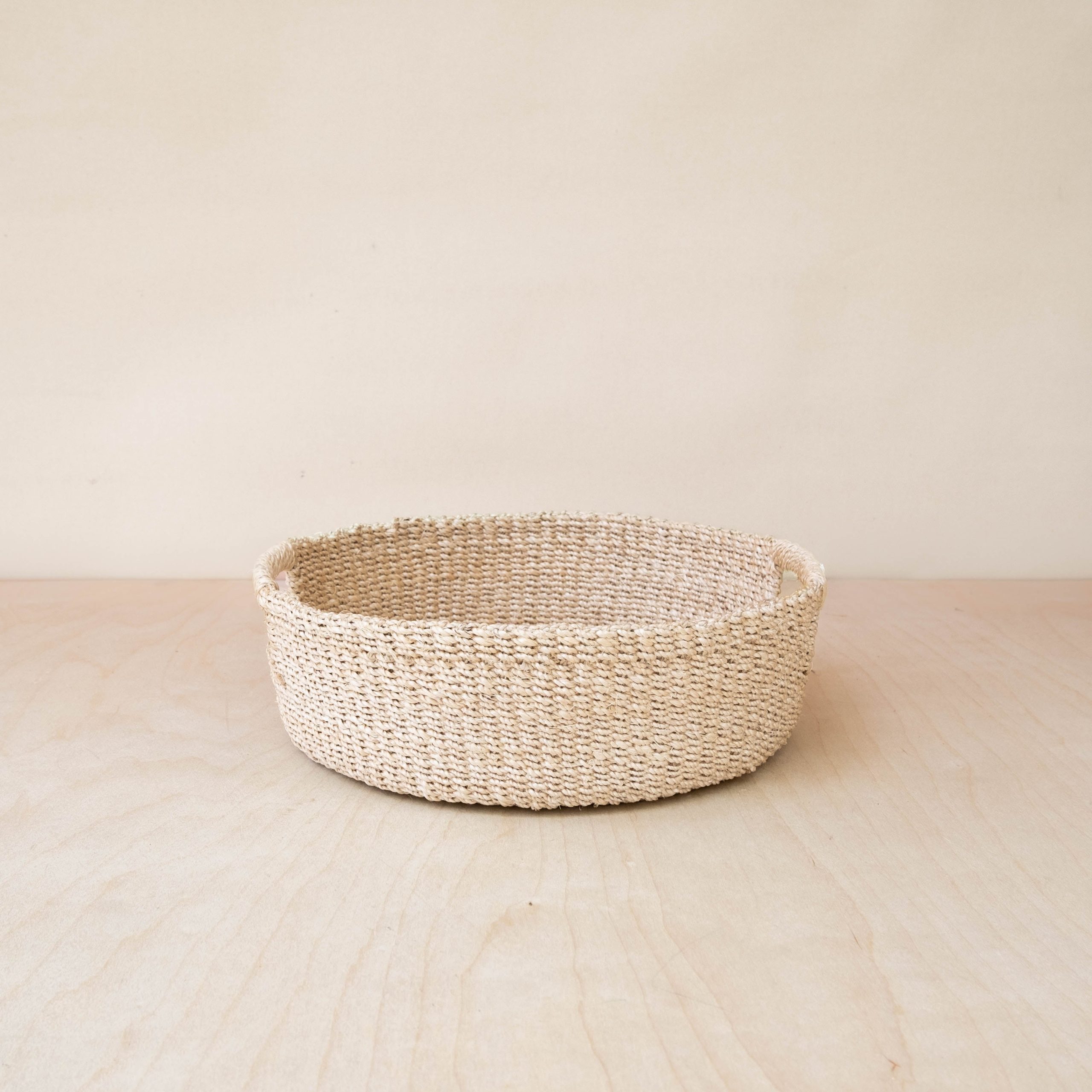 LIKHA_80117_Abaca-Round-Tray-with-Cutout-Handles-4.jpg