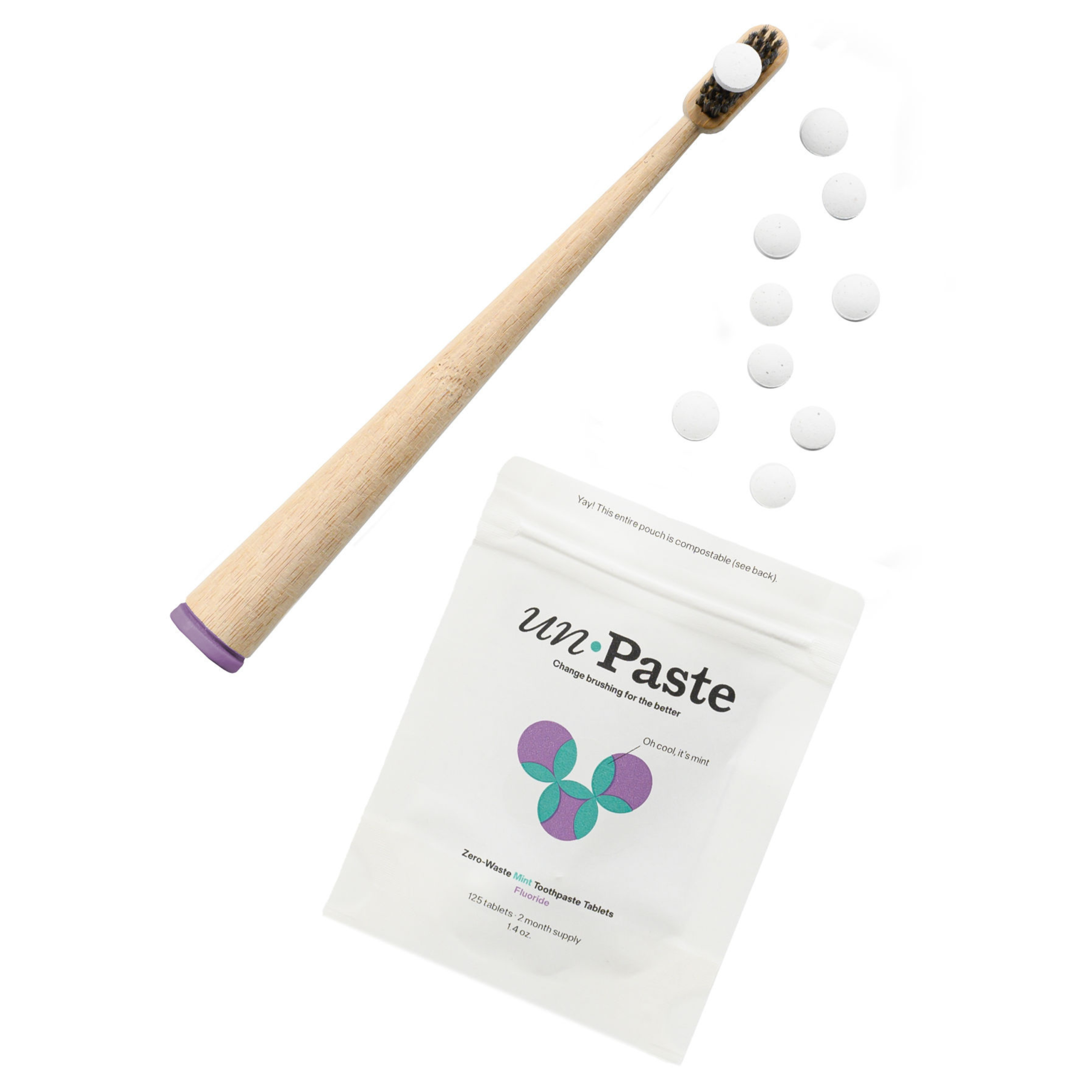 Unpaste_FluorideToothpasteTablets_Mint_125count_openpacket_tablets_toothbrush.png