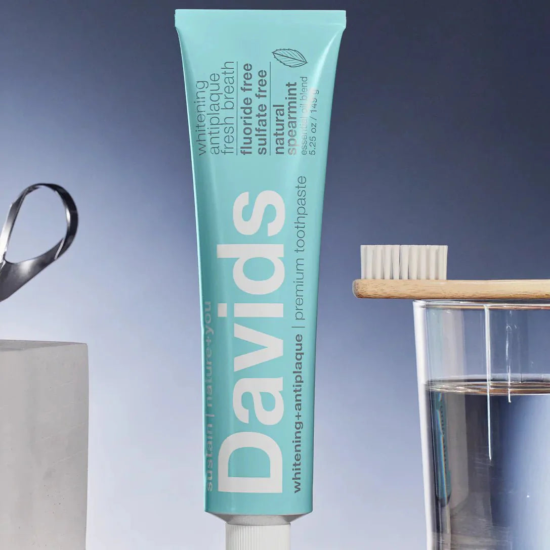 davids-spearmint-toothpaste-with-toothbrush-and-glass-of-water.jpg